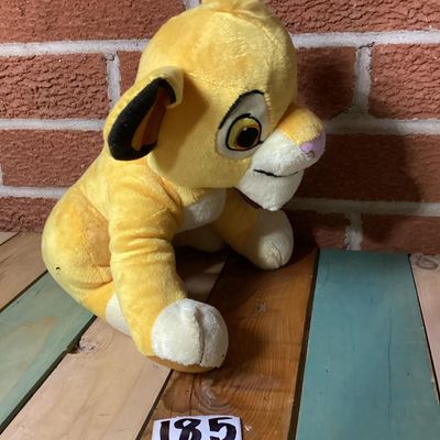 Sale Photo Thumbnail #350: Disney The Lion King Simba plush lion cub toy. Features original Kohl's Cares paper hang tags attached. In good condition with clean fabric, embroidered facial details, and soft plush material.