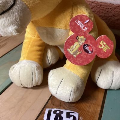 Sale Photo Thumbnail #348: Disney The Lion King Simba plush lion cub toy. Features original Kohl's Cares paper hang tags attached. In good condition with clean fabric, embroidered facial details, and soft plush material.