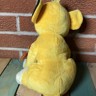 Sale Photo Thumbnail #349: Disney The Lion King Simba plush lion cub toy. Features original Kohl's Cares paper hang tags attached. In good condition with clean fabric, embroidered facial details, and soft plush material.