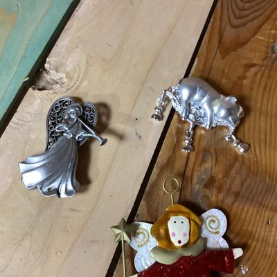Sale Photo Thumbnail #353: Lot of 3 decorative brooches featuring an angel with a trumpet, a painted angel holding a wand/star, and a silver-tone pig figure. Each piece measures approximately 2 to 4 inches long. Pre-owned condition with light surface wear visible.