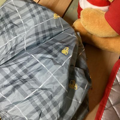Sale Photo Thumbnail #361: Lot of Disney Winnie the Pooh collectibles including a Cupid Valentine plush with wings, a honey pot, bow and arrow; a blue plaid umbrella with Pooh graphic and honey pot handle; and a quilted Christmas themed pot holder. Items show light wear consistent 