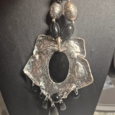 Sale Photo Thumbnail #272: Art Deco Victorian Revival Necklace & toggle bracelet
White metal pendant is covered with black set paste stones and center cabochon is black glass.
Chain comprised of black glass tube beads & Ornate silver bead / glass beads
total length 20" w/ 3"extensi