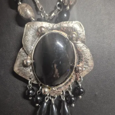 Sale Photo Thumbnail #273: Art Deco Victorian Revival Necklace & toggle bracelet
White metal pendant is covered with black set paste stones and center cabochon is black glass.
Chain comprised of black glass tube beads & Ornate silver bead / glass beads
total length 20" w/ 3"extensi
