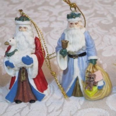 Sale Photo Thumbnail #379: 2 Santa bells, 4 Santas through the years, 1 Teddy bear with Santa hat, 1 girl with doll, See pictures