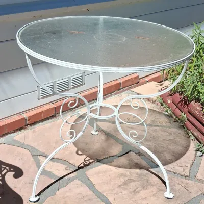 Sale Photo Thumbnail #39: Vintage wrought iron patio bistro table with scrolled legs
