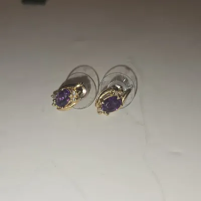Sale Photo Thumbnail #361: Amethyst and diamond accent k yellow gold stud earrings