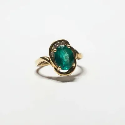 Sale Photo Thumbnail #364: K yellow gold oval emerald and diamond accent ring