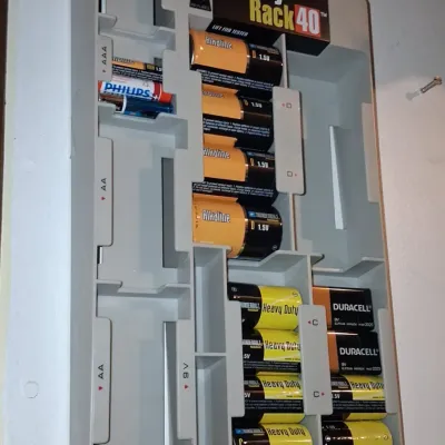 Sale Photo Thumbnail #392: Battery rack wall mount organizer