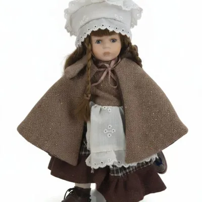 Sale Photo Thumbnail #476: The leonardo collection porcelain doll with bonnet and cape