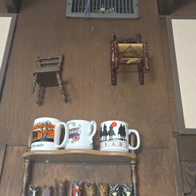 Sale Photo Thumbnail #488: Vintage nevada souvenir mugs and miniature western decor display
