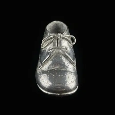 Sale Photo Thumbnail #490: Vintage silver plated baby shoe keepsake