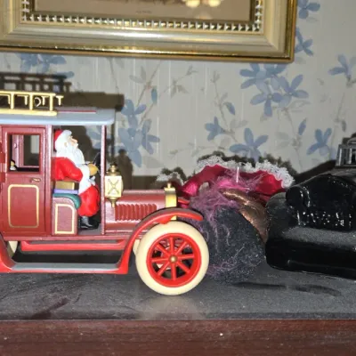 Sale Photo Thumbnail #513: Department santa in antique fire truck figurine
