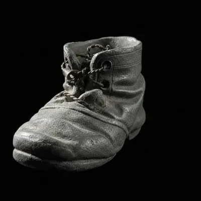 Sale Photo Thumbnail #539: Vintage cast iron child s boot figurine