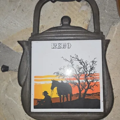 Sale Photo Thumbnail #540: Vintage cast iron teapot trivet reno souvenir cowboy and horse scenic