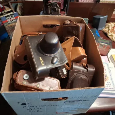 Sale Photo Thumbnail #566: Collection of vintage argus camera cases and cameras
