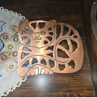 Sale Photo Thumbnail #609: Vintage odi copper cat trivet