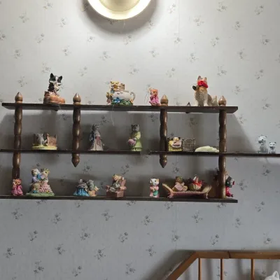 Sale Photo Thumbnail #629: Calico kittens figurine collection with wooden spindle shelf