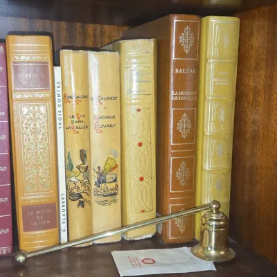 Sale Photo Thumbnail #747: Collection of classic french literature volumes and brass hand bell