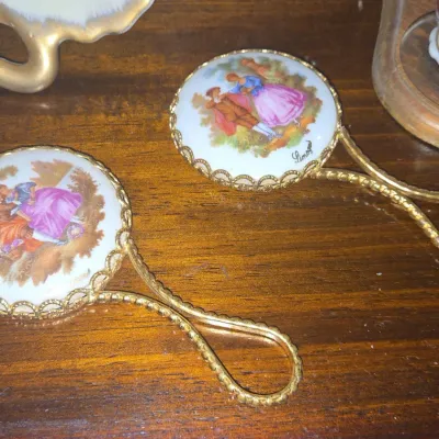 Sale Photo Thumbnail #764: Limoges porcelain hand mirror with fragonard courting couple scene