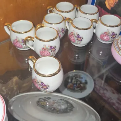 Sale Photo Thumbnail #784: Vintage porcelain demitasse cup set with courting couple motif