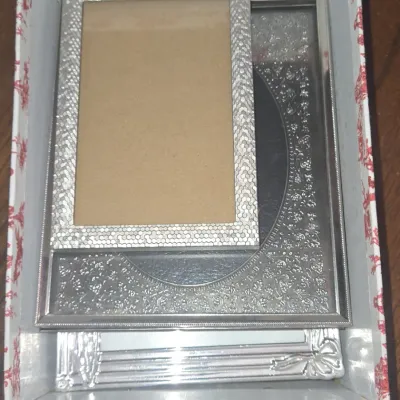 Sale Photo Thumbnail #799: Collection of three decorative silver tone picture frames