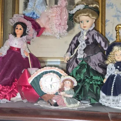 Sale Photo Thumbnail #803: Collection of vintage porcelain dolls and clocks