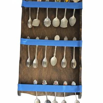 Sale Photo Thumbnail #852: Collection of vintage souvenir spoons with display rack