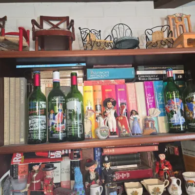 Sale Photo Thumbnail #901: Commemorative bordeaux wine bottles and historical book collection