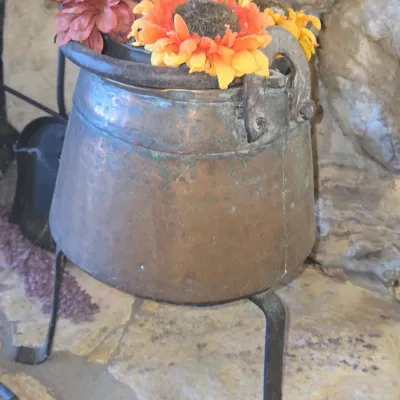 Sale Photo Thumbnail #928: Antique hand hammered copper cauldron with iron stand