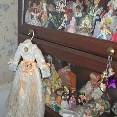 Sale Photo Thumbnail #1036: Vintage doll collection with display cabinet