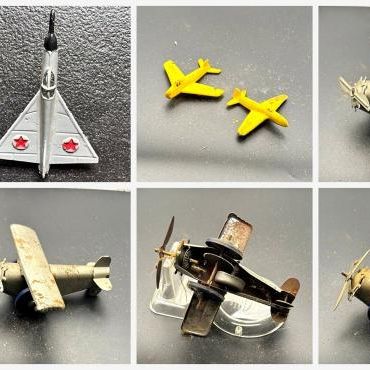 Sale Photo Thumbnail #104: Lot of vintage toy airplanes, including four lithographed tin wind-up monoplanes, a gray delta-wing jet with red star markings, two small yellow "USAF" planes, and a small diecast camouflage RAF jet with roundels (Dinky-style Hawker Hunter type). Two show