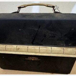 Sale Photo Thumbnail #124: Vintage Thermos brand insulated lunch kit / mini cooler: black and cream dome-top carrier with handle and gold Thermos logo, removable insulated liner with latches and cream lid, and an orange Thermos vacuum bottle with cream cup/cap. Classic mid-century 