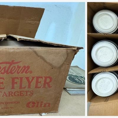 Sale Photo Thumbnail #143: Vintage case of Western "White Flyer" clay pigeon targets in the original shipping box marked "135 Targets – Winchester-Western Division, Olin Corporation, New Haven, Conn. and East Alton, Ill." Partitioned box contains multiple stacked sleeves of white