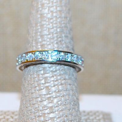 Size 6¼ Infinity Style Ring with Full Row of Round Clear Stones on a Silver Tone Band (4.4g)