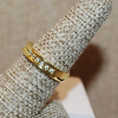 Size 8 Half Infinity Style Ring with Center Row of Clear Stones on a Gold Tone Band (3.6g)