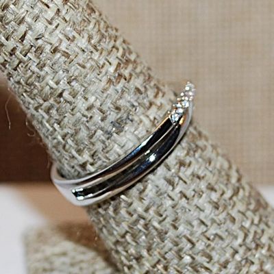 Size 8 Half Infinity Criss-Cross Ring with 2 Rows of Small Stone Accents on a Silver Tone Band (2.4g)