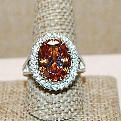 Size 10½ Marked .925 Large ORANGE AMBER Oval Stone with Nested Full Surround on a Silver Band (8.7g)