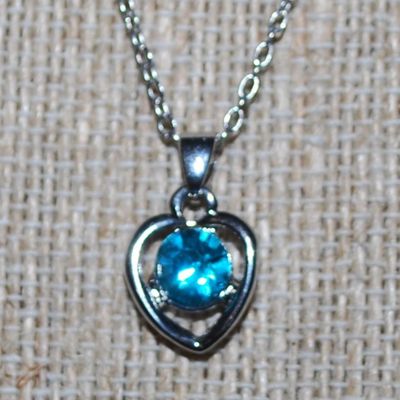 Round Blue Stone in a HEART Setting PENDANT (½" x ½") on a Silver Tone Necklace Chain 16" L