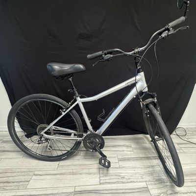 Sale Photo Thumbnail #24: This 8-speed bicycle is constructed of Smart Form C3 alloy. It has Shimano Acera rear derailleur, and Rapidefire Plus shifters. It has a 28-inch frame. Pre-auction estimate: $450-$650. [AG]