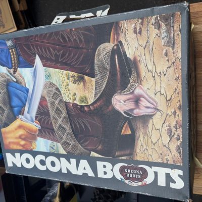 Sale Photo Thumbnail #28: A pair of vintage Nocona men's western cowboy boots crafted in dark polished leather with detailed shaft stitching. Includes the original Nocona Boots graphic box with original tissue paper lining. Boots appear to be in good vintage condition with minor s