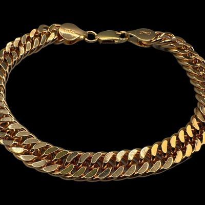 Sale Photo Thumbnail #63: This curb link bracelet has a gold vermeil wash. The clasp may need repair. Measurement: 8”L. The weight is 22.41 grams. [VY]