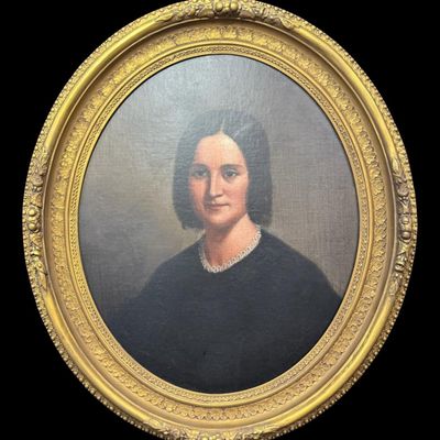 Sale Photo Thumbnail #71: This exceptional piece depicts a dignified Victorian woman. It is quite detailed, showing mid-19th century period dress, contrasted by an intricate, delicately painted lace neckline or collar. It is in an ornate period gilt frame. This appears to be stret