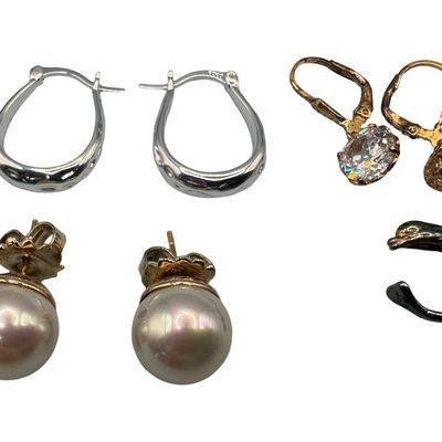 Sale Photo Thumbnail #81: Includes a pair of 12mm pearl stud earrings with a gold vermeil wash over sterling, a pair of hoop earrings, a pair of clear stone dangle earrings with a gold vermeil wash, and a dolphin ear cuff. Total of three pairs of earrings and one ear cuff. The tot