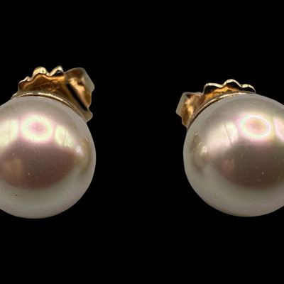 Sale Photo Thumbnail #82: Includes a pair of 12mm pearl stud earrings with a gold vermeil wash over sterling, a pair of hoop earrings, a pair of clear stone dangle earrings with a gold vermeil wash, and a dolphin ear cuff. Total of three pairs of earrings and one ear cuff. The tot