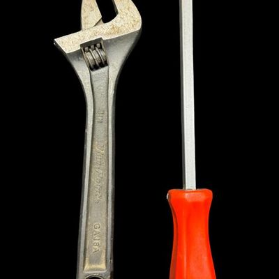 Sale Photo Thumbnail #95: Includes a Snap-On CSA10B 12” pry bar/chisel/punch, also called a rigid carbon gasket scraper; and a Blue-Point GAJ6A six-inch adjustable wrench manufactured by Snap-On. Total of two pieces. Pre-auction estimate: $50-$75. [CS]
