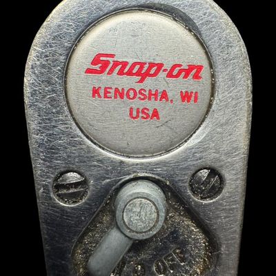 Sale Photo Thumbnail #137: The Snap-On TQFR100A is a 3/8-inch flex-head torque wrench with a range of 20 to 100 ft-lbs. The ratcheting swivel flex-head tilts up to 15 degrees. Not tested. Pre-auction estimate: $100-$200. [CS]