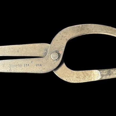 Sale Photo Thumbnail #143: Includes Snap-On 231, designed for removing and installing drum brake springs on trucks; and Snap-On 131A, designed for removing and installing drum brake springs on passenger vehicles. Total of two pieces. Pre-auction estimate: $75-$125. [CS]