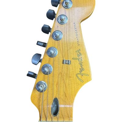 Sale Photo Thumbnail #150: This piece is believed to be completely original. It features a maple neck and fingerboard with 22 frets. It has Dual Hot vintage Alnico humbucking pickups with metal covers. The body is made of alder wood. This guitar was made in Mexico. The stand is inc