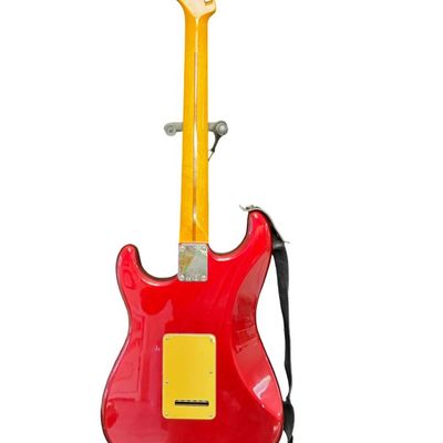 Sale Photo Thumbnail #151: This piece is believed to be completely original. It features a maple neck and fingerboard with 22 frets. It has Dual Hot vintage Alnico humbucking pickups with metal covers. The body is made of alder wood. This guitar was made in Mexico. The stand is inc