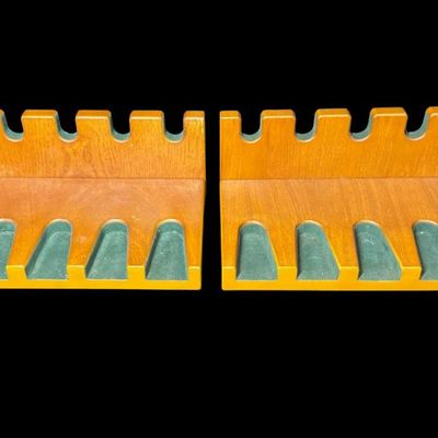Sale Photo Thumbnail #156: Includes a pair of high quality oak pistol displays. Each holds up to six handguns, and both are gently used. Measurement: 15.5”W x 7”L (each). Pre-auction estimate: $50-$100. [RS]